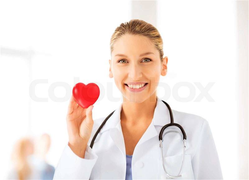 Bright picture of female doctor with heart, stock photo