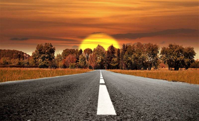 Lonely road to a place where there is a sunset or sunset, stock photo