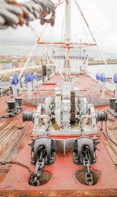 View of ship deck with engine anchors and chains, stock photo