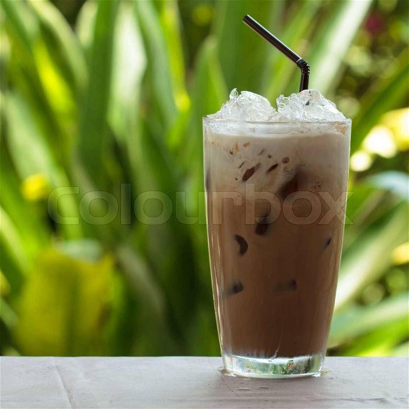 Iced coffee with milk is on the table, stock photo