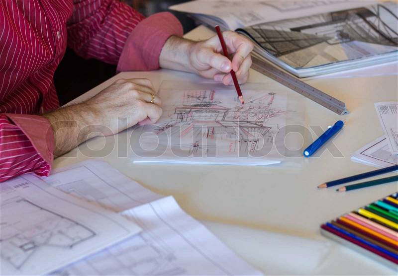 Architect or business young man drawing sketch of modern house, stock photo