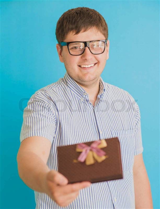 Man with a gift box in hands, stock photo