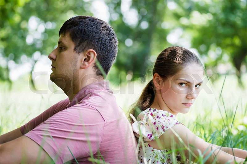 Husband and wife turned away from each other, stock photo