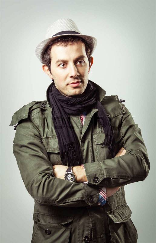 Portrait of young man wearing hat and scarf, stock photo