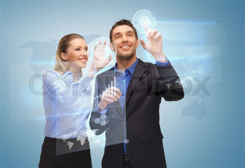 Picture of two business people working with virtual screen, stock photo