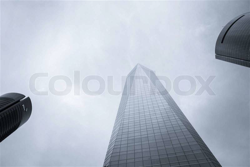 MADRID, SPAIN - MARCH 10 Cuatro Torres Business Area CTBA, in Madrid, Spain, on March 10, 2013. Detail view of PwC Tower, Glass Tower and Space Tower skyscrapers, stock photo