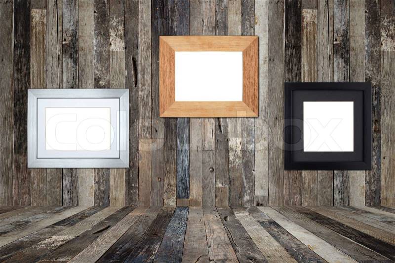 Wooden picture frames on the old wooden wall, stock photo