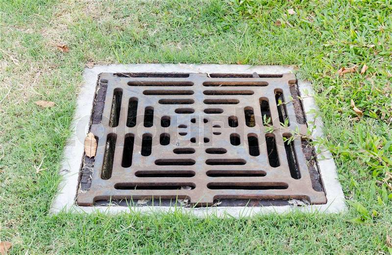 Drain on filed,sewer cover, stock photo