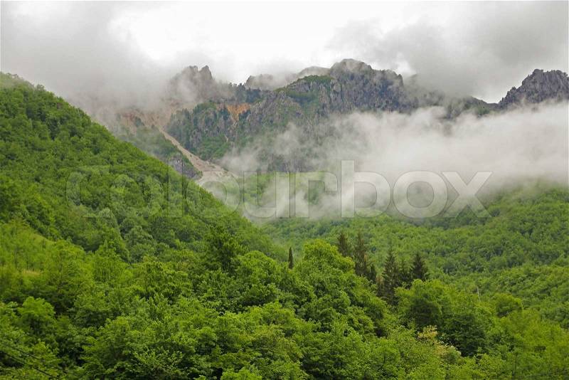 Fog and cloud mountain valley landscape in Montenegro, stock photo