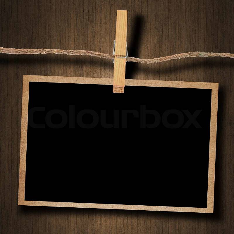 Old photo and clothes peg wood background, stock photo