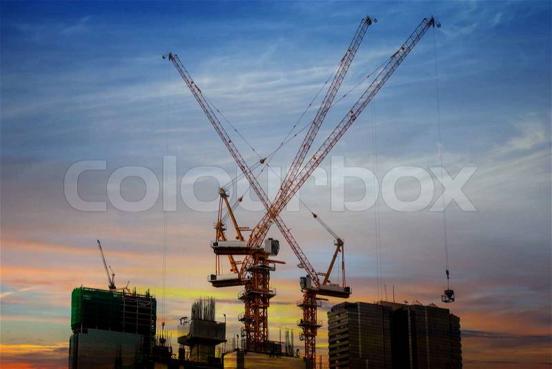 Building under construction with workers, stock photo