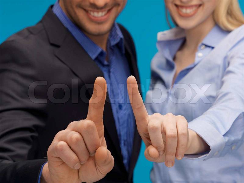 Picture of man and woman hands pointing at something, stock photo