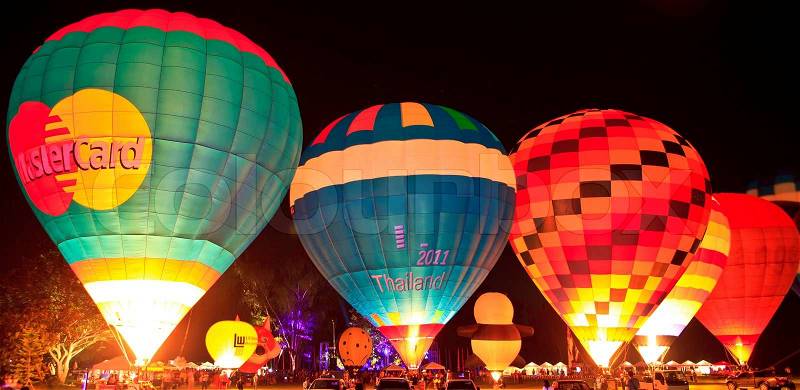 CHIANGMAI, THAILAND-NOVEMBER 23 : People come to watch the release of balloons in the night at Thailand International Balloon Festival in Chiang Mai on November 23, 2012 in Chiangmai,Thailand, stock photo