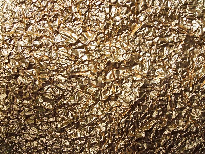 Golden aluminum foil texture background, stock photo