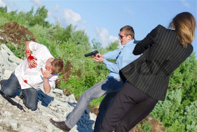 Two FBI agents arresting an offender with knife, stock photo