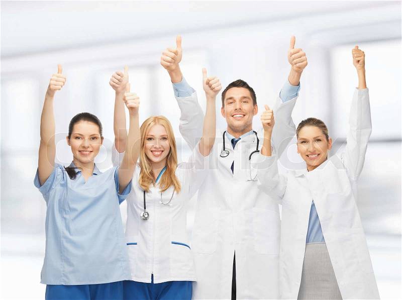 Professional young team or group of doctors showing thumbs up, stock photo