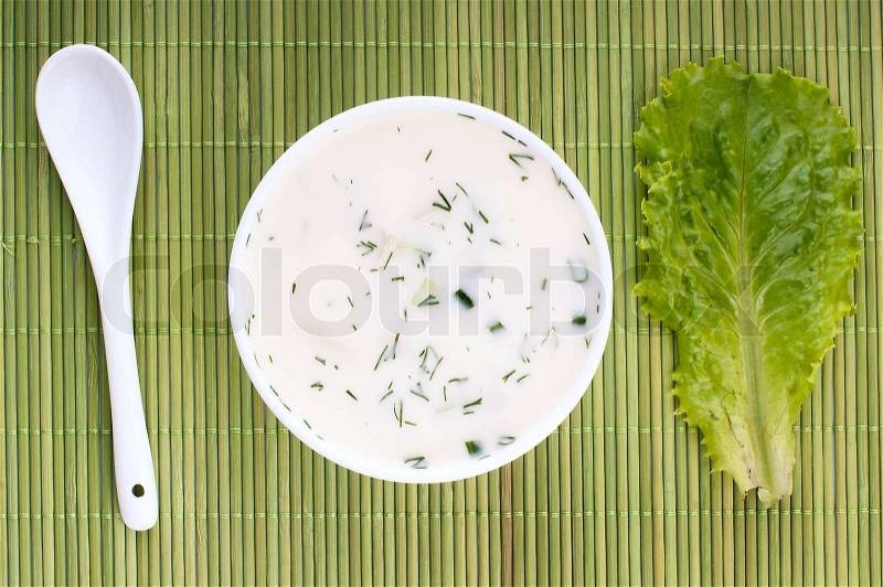 Close-up of russian cold vegetable soup on yoghurt sour-milk base - okroshka, stock photo