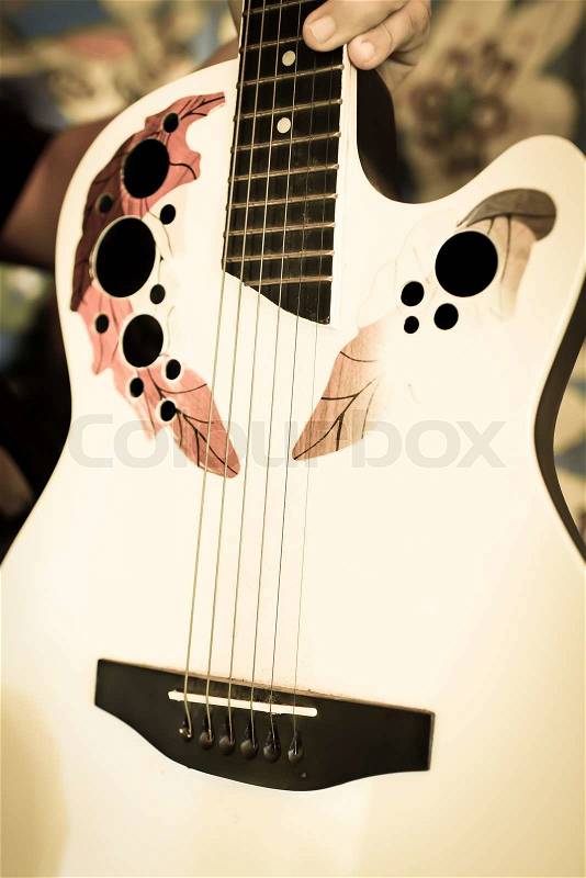 Detail of classic guitar with shallow depth of field, stock photo