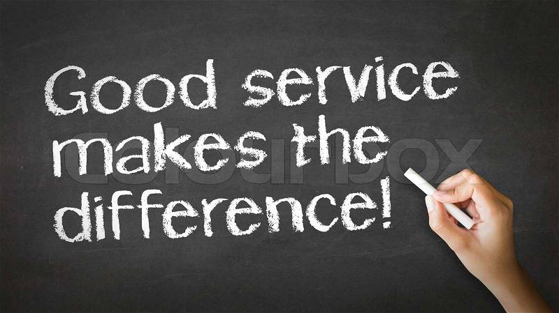 A person drawing and pointing at a Good Service makes the difference Chalk Illustration, stock photo