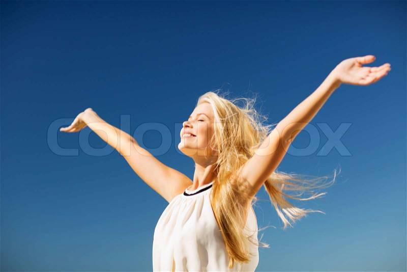 Lifestyle concept - beautiful happy woman enjoying summer outdoors, stock photo