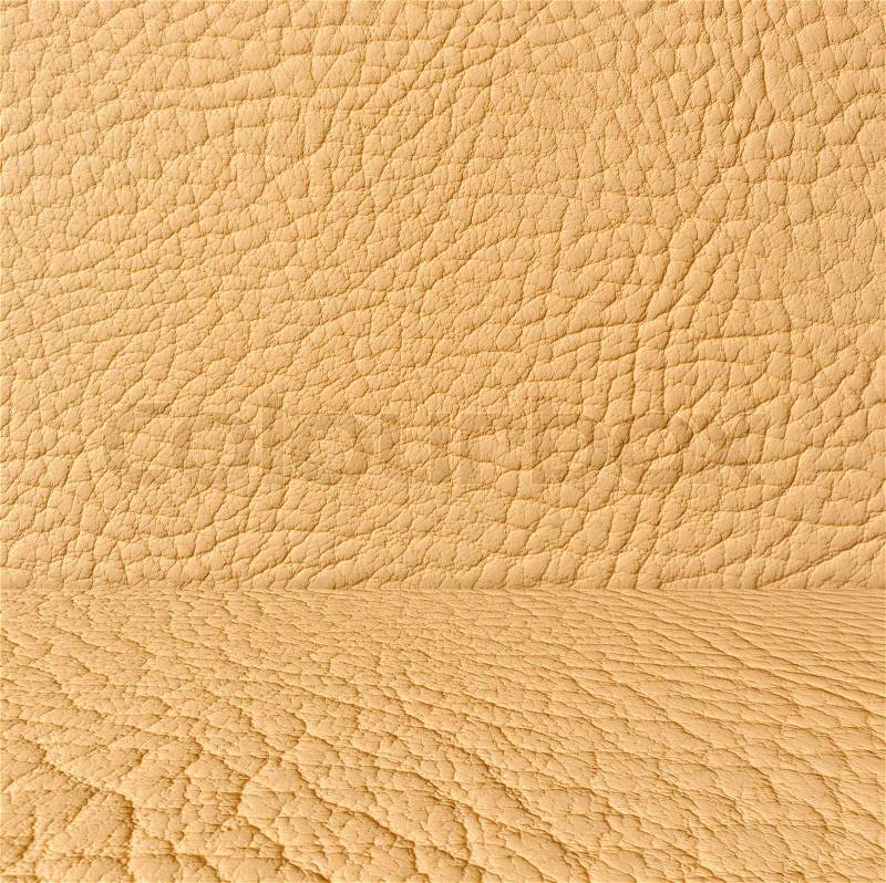 A creative beige artificial leather room as a background, stock photo