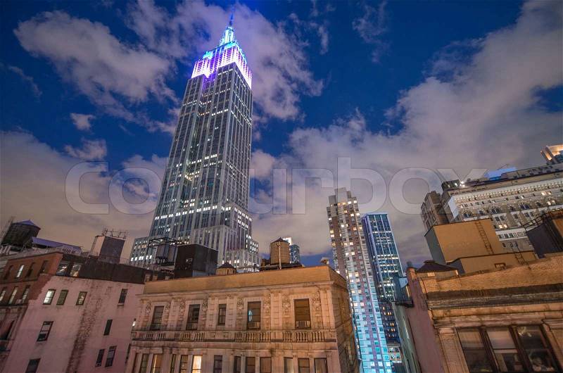 NEW YORK CITY - JUN 8: Night view of the Empire State Building, June 8, 2013 in NYC. Empire State Building is a 102-story landmark and was world\'s tallest building for more than 40 years, stock photo