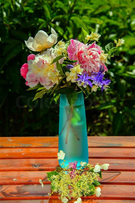 Making bouquet of summer flowers, stock photo