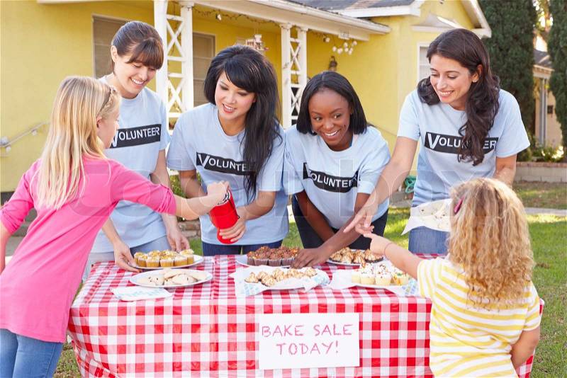 Women And Children Running Charity Bake Sale, stock photo