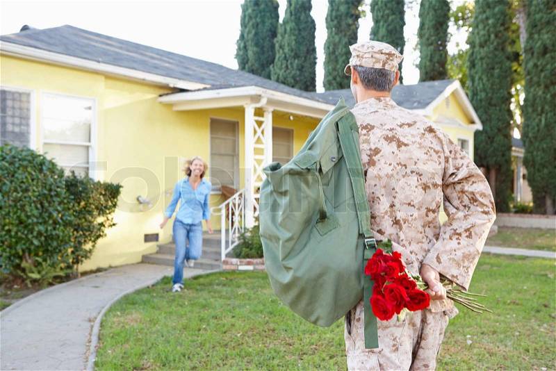 Wife Welcoming Husband Home On Army Leave, stock photo
