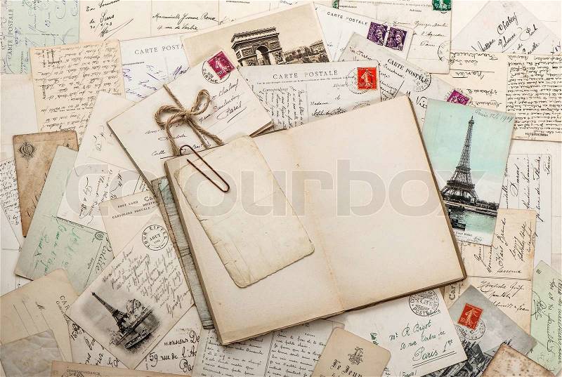 Open empty diary book, old letters, french postcards. nostalgic vintage scrapbook background, stock photo