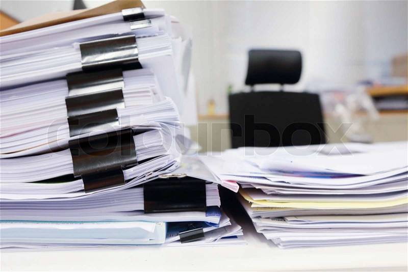 Messy office table with business documents, stock photo