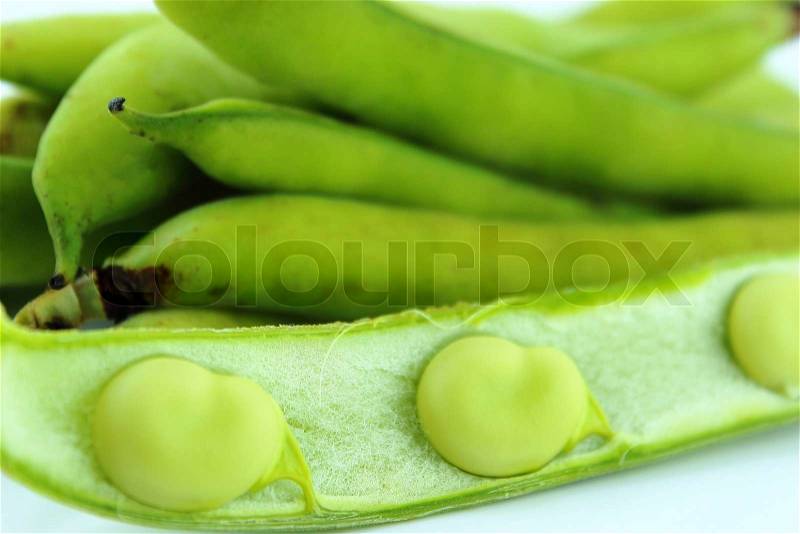 Broad bean pods and beans on white background , stock photo