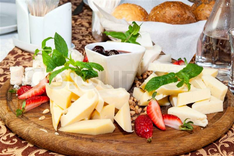 Cheese plate with a large decorated the assortment of mint, stock photo