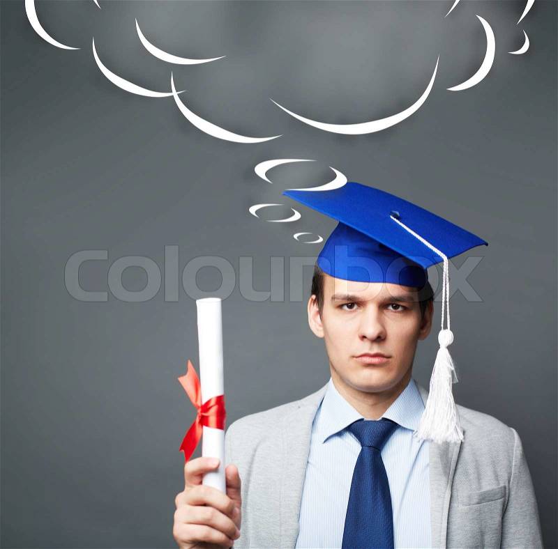 Portrait of confident student with graduation certificate looking at camera, stock photo