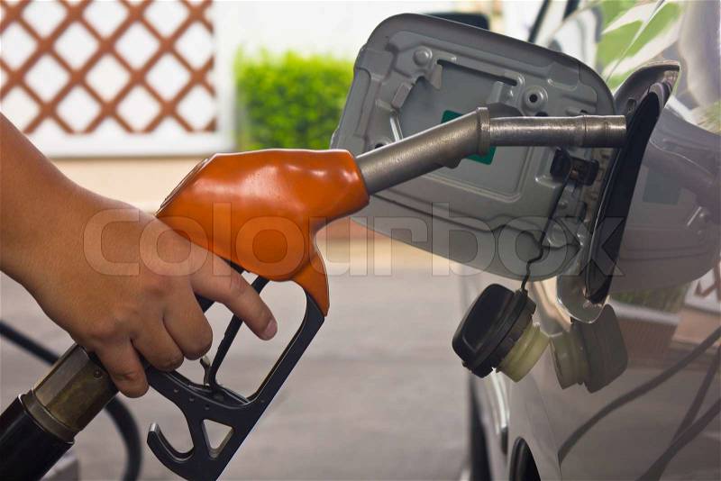 Fill up fuel at gas station, stock photo