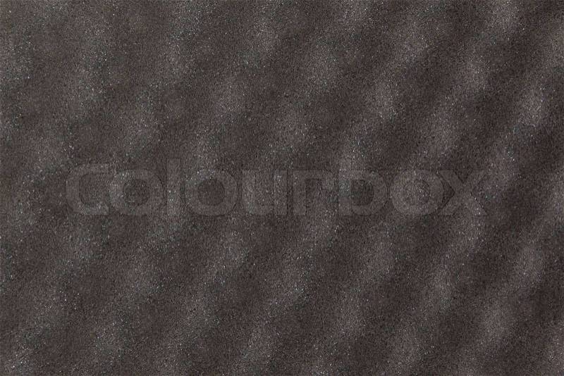 Black bumpy safety material isolated, selective focus, stock photo