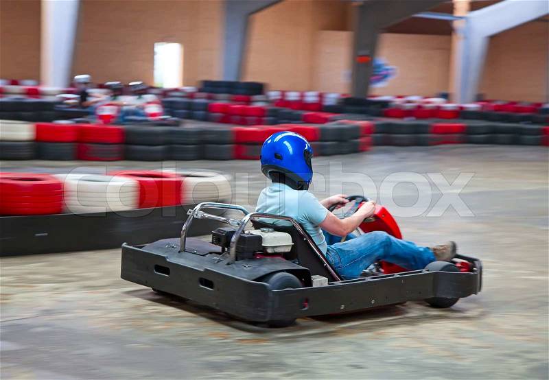 Indoor karting race kart and safety barriers, stock photo