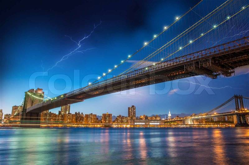 Night sky above Brooklyn Bridge and Manhattan Bridge - New York City, stock photo