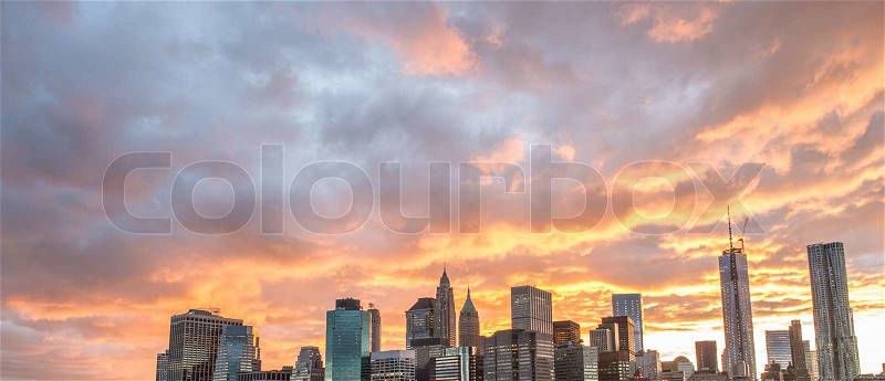 Manhattan skyline with beautiful sunset sky - New York City, stock photo
