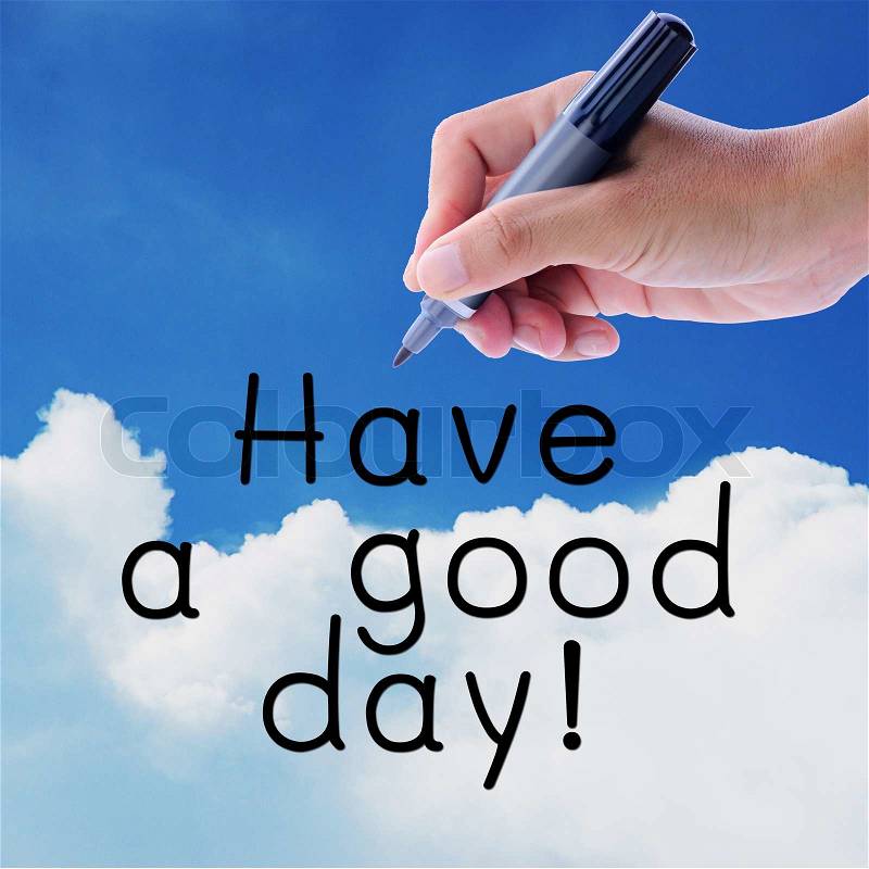Man hand writing word, Have a good day, on on sky and cloud, stock photo