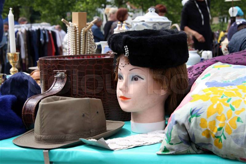 Scene from Flea market where people sell and buy used toys, clothes, pictures, kitchen ware and other things, stock photo