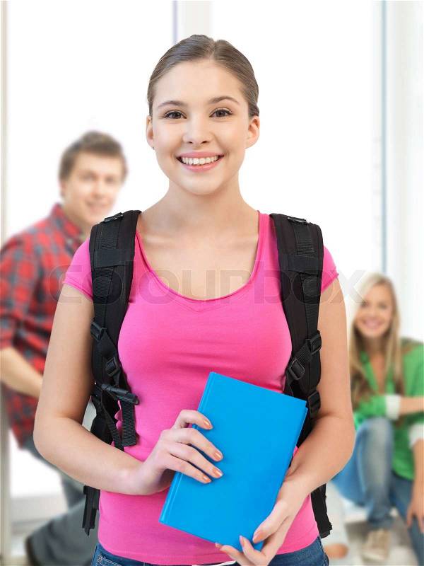Education concept - smiling student girl with book and school bag, stock photo