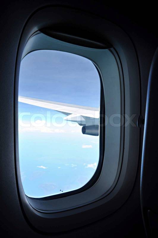 Blue sky view from window of the airplane, stock photo