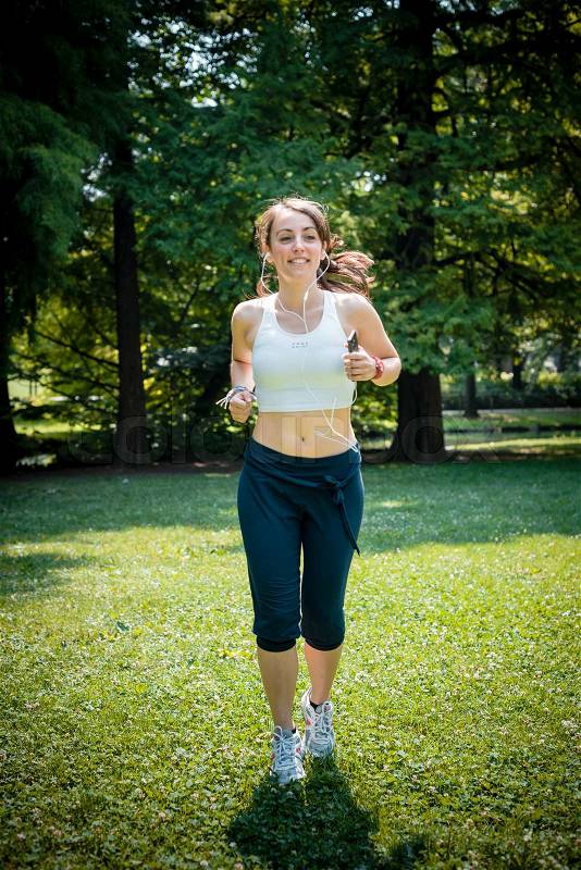 Beautiful woman fitness running at the park, stock photo