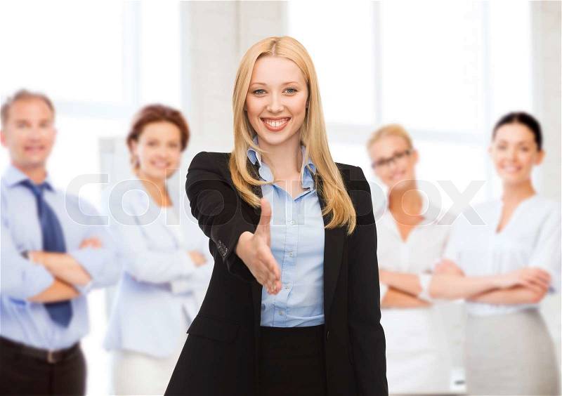 Business concept - woman with an open hand ready for handshake, stock photo