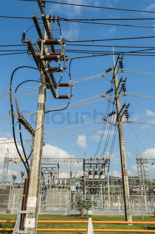 Electric power station and high-tension post with blue sky, stock photo