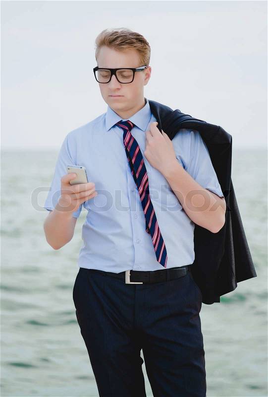 Businessman with phone, stock photo