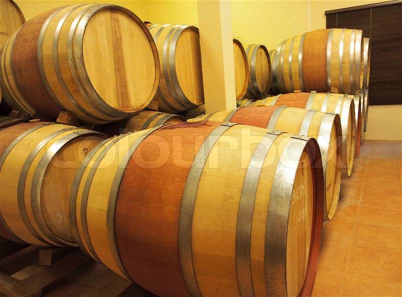 Oak wood wine barrel in the row, winery, stock photo