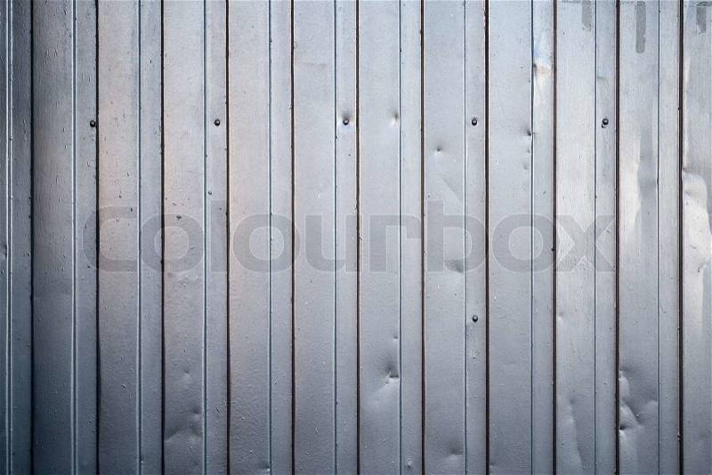Shining ridged metal fence. Background photo texture, stock photo