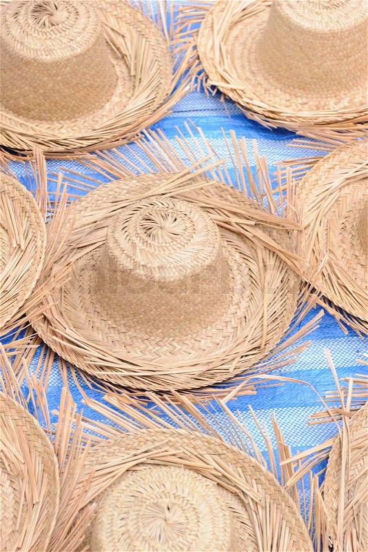 Straw hat in local market, stock photo